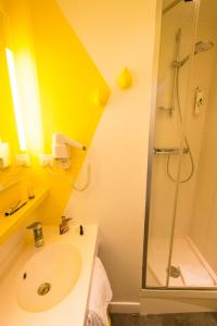 a bathroom with a sink and a shower at Ibis Styles Rouen Centre Cathédrale in Rouen