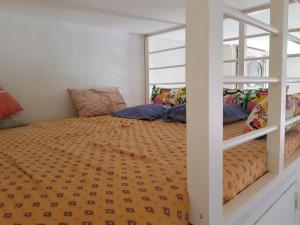 מיטה או מיטות בחדר ב-Mini Loft