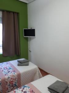 Postel nebo postele na pokoji v ubytování Casa Pueblo Alzira No Compartida