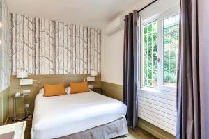 Ein Bett oder Betten in einem Zimmer der Unterkunft Passy Eiffel