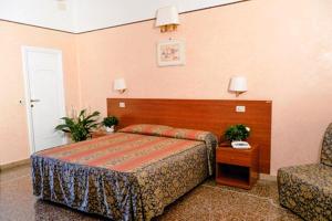 Posteľ alebo postele v izbe v ubytovaní Hotel Miramare