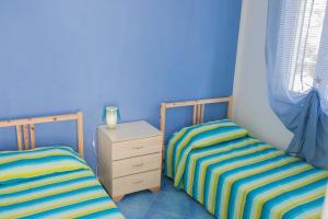 Кровать или кровати в номере Cilento Pixous Casa Vacanza