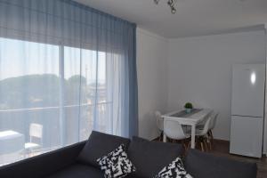 Posedenie v ubytovaní Apartamentos AR Muntanya Mar
