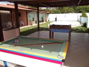 a pool table in the middle of a yard at Jacarandá Palace Hotel in Teixeira de Freitas
