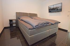 Ein Bett oder Betten in einem Zimmer der Unterkunft Ferienhaus Merzijana