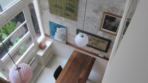 a room with a wooden table and a window at Stipologic 6P 2BR in Paris