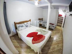 Postel nebo postele na pokoji v ubytování Suítes Cantinho da Pedra