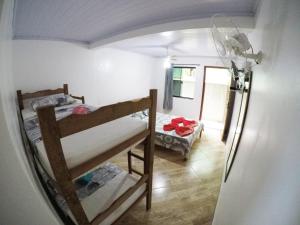 Postel nebo postele na pokoji v ubytování Suítes Cantinho da Pedra