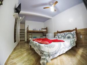 Postel nebo postele na pokoji v ubytování Suítes Cantinho da Pedra
