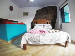 Postel nebo postele na pokoji v ubytování Suítes Cantinho da Pedra