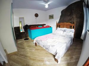 Postel nebo postele na pokoji v ubytování Suítes Cantinho da Pedra