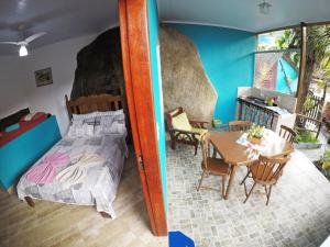 Postel nebo postele na pokoji v ubytování Suítes Cantinho da Pedra