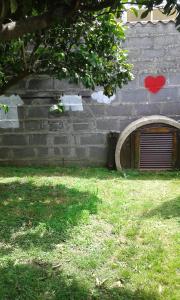 a building with two hearts on the side of it at Casa de Madera in Cangas de Morrazo