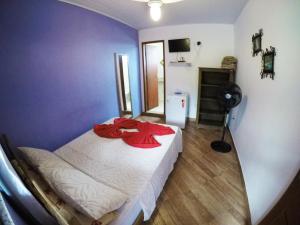 Postel nebo postele na pokoji v ubytování Suítes Cantinho da Pedra