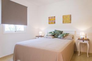 Postel nebo postele na pokoji v ubytování Attico Estrella