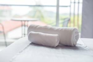 two rolls of toilet paper sitting on top of a counter at Lemonade Phuket Hotel -SHA Plus in Chalong +37 photos