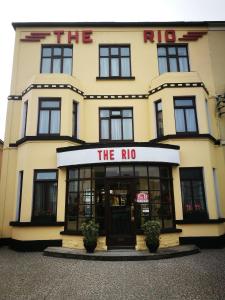 a large yellow building with the rio sign on it at The Rio in Galway