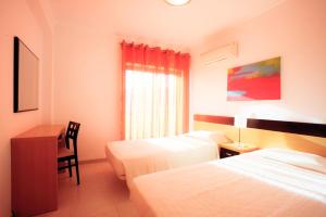 Cama o camas de una habitación en Areias da Rocha by amcf