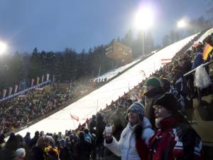 a large crowd of people standing on a ski slope at FeWo-Tannenhof in Medebach