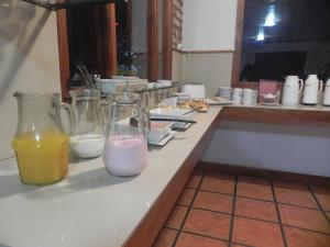 a kitchen counter with two bottles of milk and orange juice at Mirando al Sur in San Carlos de Bariloche