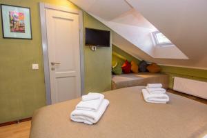Postel nebo postele na pokoji v ubytování Kindli Boutique Hotel + 37 fotografií