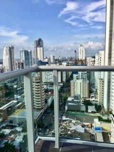 a view of a city from the balcony of a building at luxuriuso apartament in Cartagena de Indias