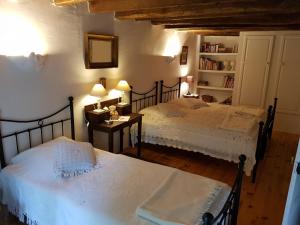 En eller flere senger på et rom på Moulin De Sardeix ( De Cottage )