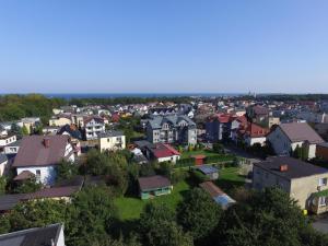 an aerial view of a town with houses at Orle Gniazdo in Władysławowo