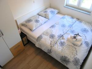 Postel nebo postele na pokoji v ubytování Apartman Danijel