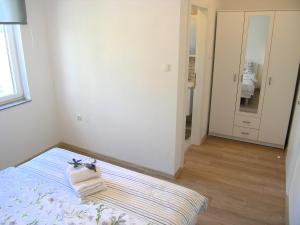Posteľ alebo postele v izbe v ubytovaní Apartman Danijel