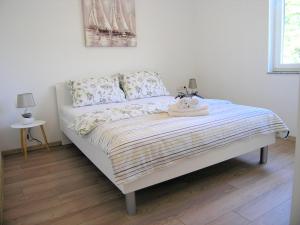 Posteľ alebo postele v izbe v ubytovaní Apartman Danijel