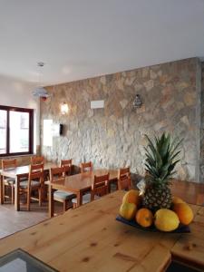 a dining room with a table with a pineapple on it at Sol Mar in Odeceixe +37 photos