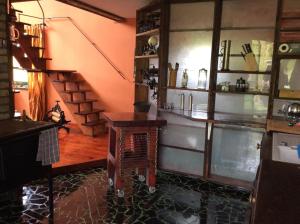 a room with a counter and a staircase in it at Haus 9 am Fluss in Witnica