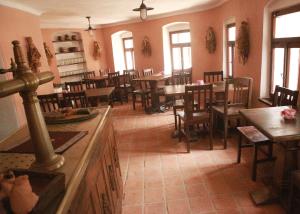 a restaurant with tables and chairs and a dining room at Krumlovské domky in Český Krumlov