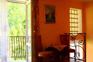 a dining room with a table and a window at Villa Bri in Łeba