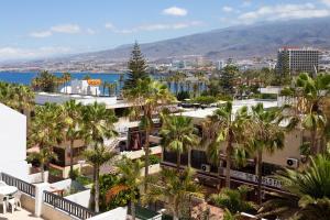 an aerial view of a city with palm trees at Parque Santiago 2 apartamento 410 in Arona