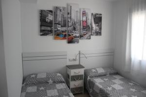 Un pat sau paturi într-o cameră la Bungalow Zenia Boulevar