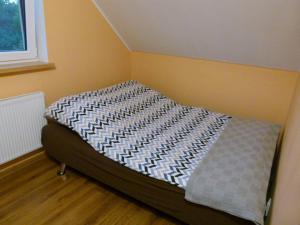 Llit o llits en una habitació de Dom pod Wierzbami