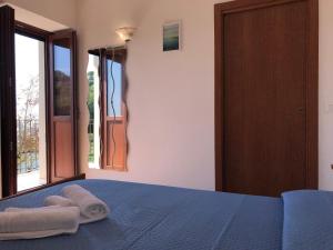 Postel nebo postele na pokoji v ubytování Cala San Francesco B&B