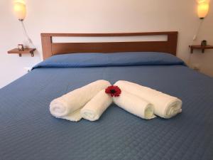 Postel nebo postele na pokoji v ubytování Cala San Francesco B&B