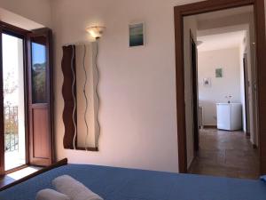 Postel nebo postele na pokoji v ubytování Cala San Francesco B&B