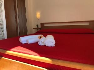Postel nebo postele na pokoji v ubytování Cala San Francesco B&B