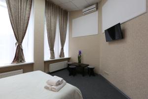 Archi Hotel Na Tulskoy Moscow tesisinde bir odada yatak veya yataklar