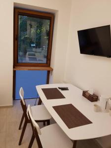 TV a/nebo společenská místnost v ubytování Kolmark Residence + 12 fotografií