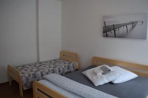 Postel nebo postele na pokoji v ubytování Apartmány Lípa