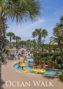 a group of people swimming in a pool at an oceanwalk at Ocean Walk Resort 2 BR Condo A135 in Daytona Beach