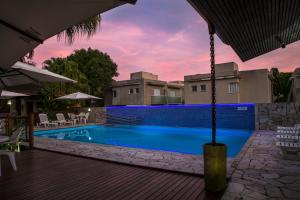 A piscina localizada em Pousada Sol e Mar ou nos arredores
