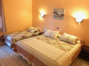 Кровать или кровати в номере Hotel CostaFósil