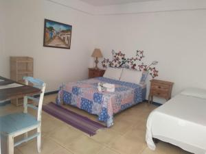 Eco suites Caravelas tesisinde bir odada yatak veya yataklar
