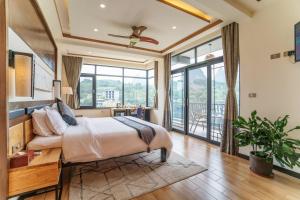 Llit o llits en una habitació de The Bamboo Leaf Yangshuo
